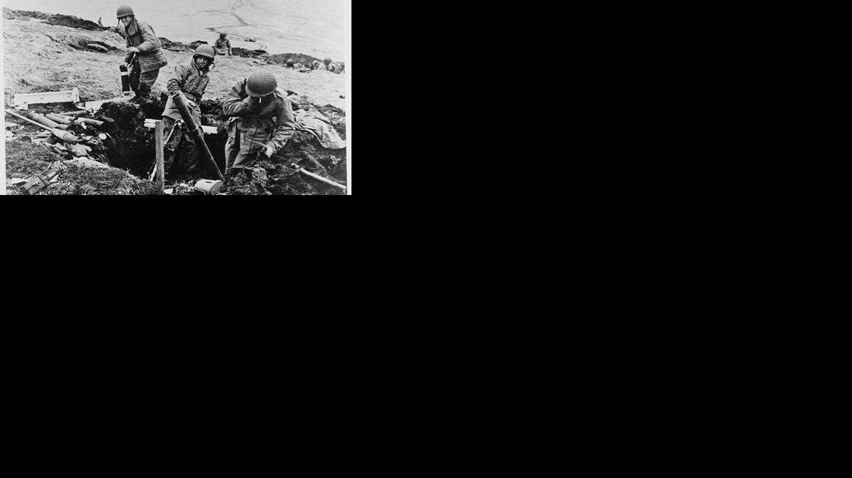 Soldiers hurling their trench mortar shells over a ridge into a Japanese position on Attu, an Aleutian Island, June 4, 1943.