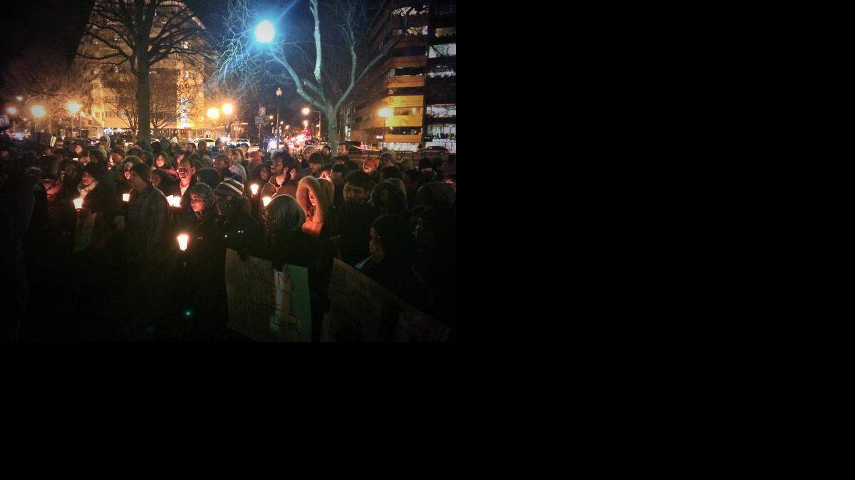 A vigil in to honor the lives of three university students gunned down earlier this week was held in Dupont Circle in Washington D.C., February 12, 2015
