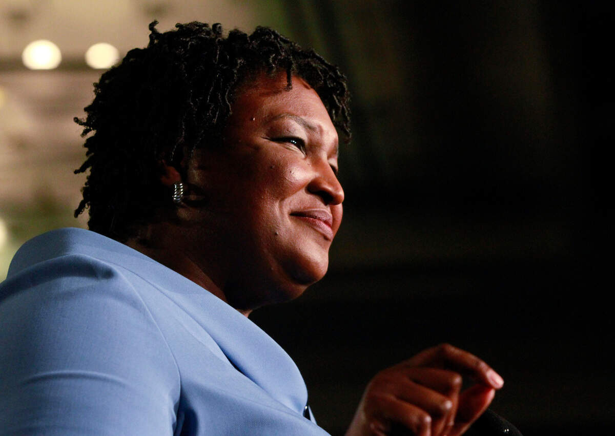 Democratic gubernatorial candidate Stacey Abrams speaks to her supporters Tuesday night during a campaign rally in downtown Atlanta. She gave a fiery speech urging supporters to wait until all votes were counted before losing hope.