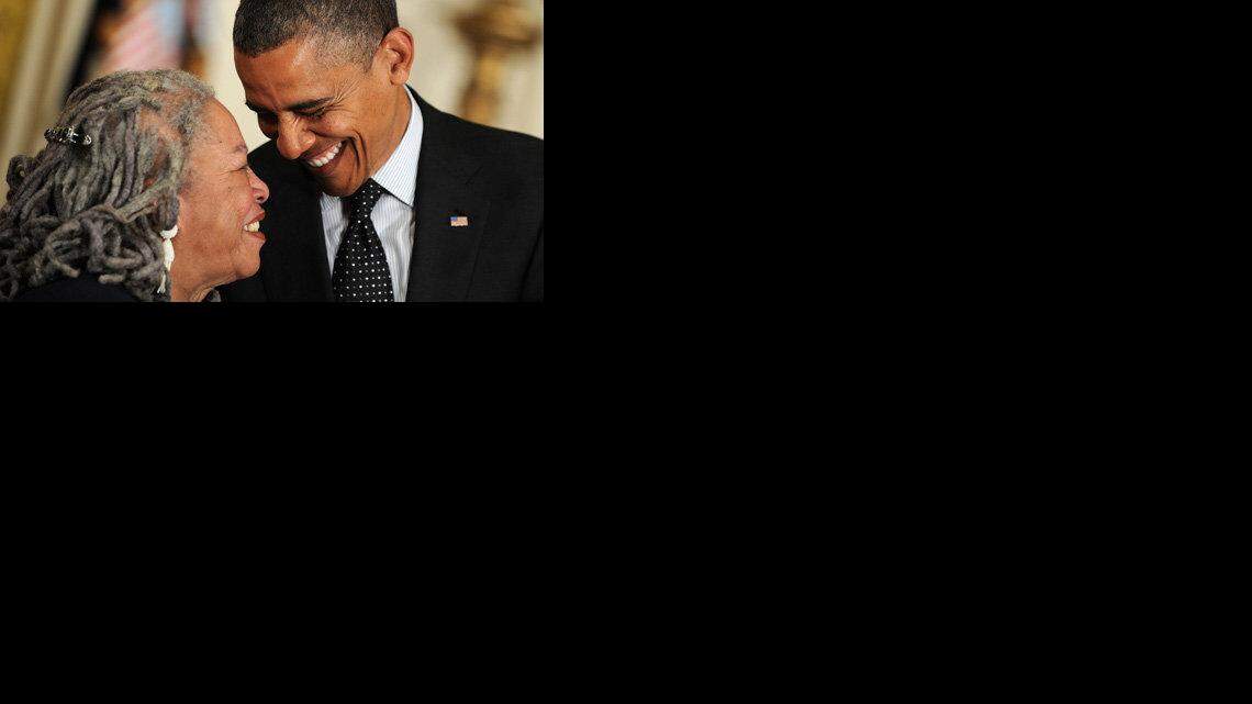 President Barack Obama shares a laugh with author Toni Morrison as he awards her the Presidential Medal of Freedom.