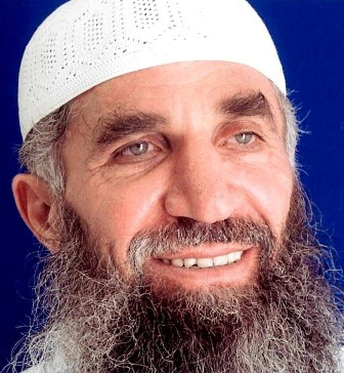 Guantánamo prisoner Abd al Hadi al Iraqi, who says his true name is Nashwan al Tamir, poses for the International Red Cross in a 2014 photo taken for his family, and provided by his attorneys.