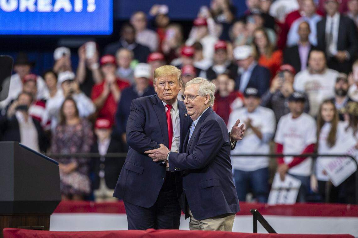 President Donald Trump shakes hands with U.S. Senator Mitch McConnell during a rally at Rupp Arena in Lexington, Ky., Monday, Nov. 4, 2019.