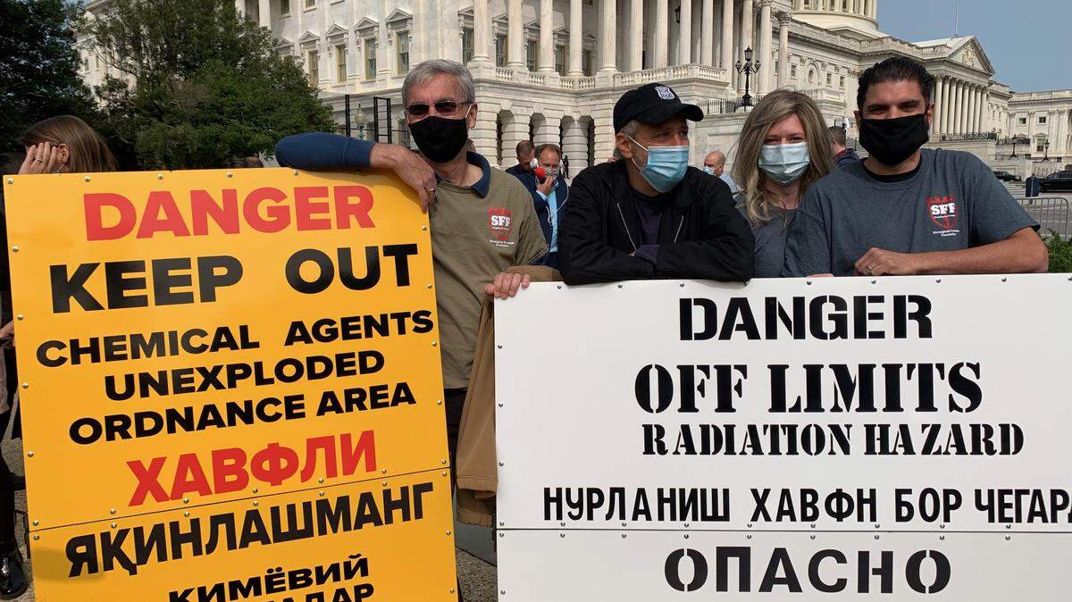 Comedian Jon Stewart (second from left) talks with military veterans who served at Karshi-Khanabad, Uzbekistan, or K2, during a press conference on Capitol Hill to pressure Congress to fund the health care needs of veterans who are now suffering cancers or other chronic illnesses due to their exposures to toxic contaminants they experience while deployed.