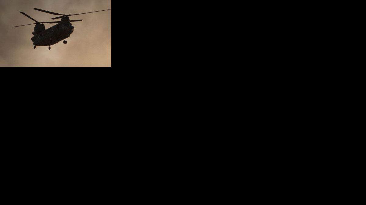 Thirty U.S. special forces, a translator and seven Afghan soldiers were killed when a helicopter, similar to the one shown crashed in eastern Wardak province Saturday, Aug. 6, 2011. (AP Photo/Anja Niedringhaus)