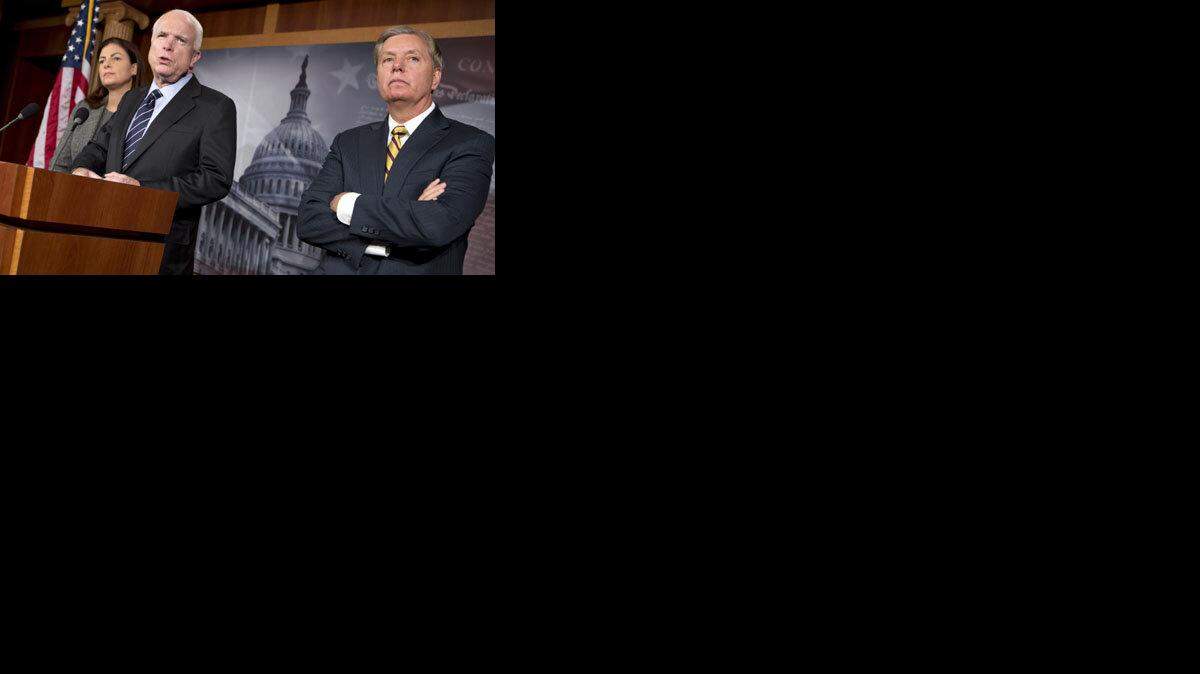 Sen. John McCain, R-Ariz., center, Sen. Kelly Ayotte, R-N.H., left, and Sen. Lindsey Graham, R-S.C., hold a news conference Wednesday.