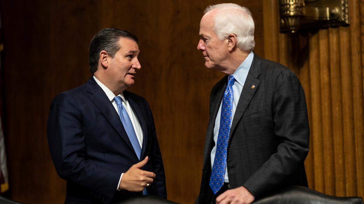 Sen. Ted Cruz, R-Texas, talks with Sen. John Cornyn, R-Texas, during a break in hearing testimony from then-Supreme Court nominee Brett Kavanaugh before the Senate Judiciary Committee in Washington, Sept. 27, 2018.