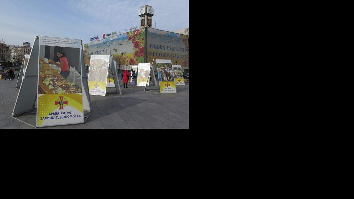 A display in Independence Square in Kiev, Ukraine, titled "The forces fight, defend and help." The posters encourage public donations to the troops, and present evidence that Russia is actively engaged in an invasion of Ukraine, Feb. 24, 2015
