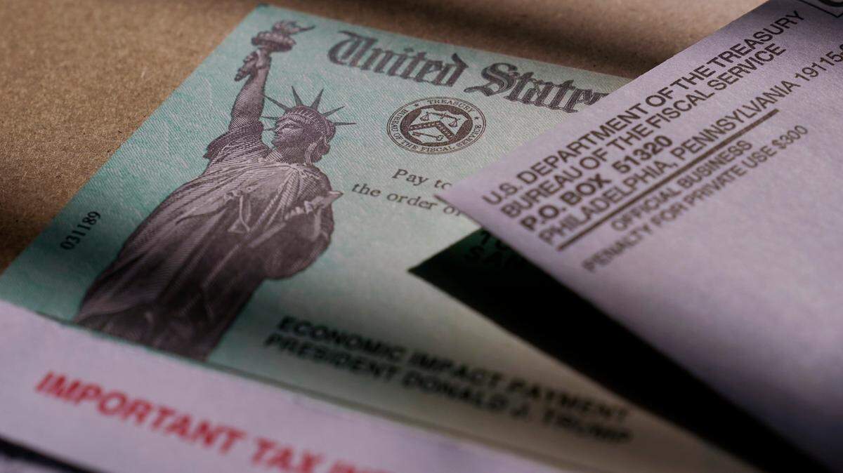 A stimulus check issued by the IRS to help combat the adverse economic effects of the COVID-19 outbreak is seen in San Antonio, Thursday, Jan. 28, 2021. (AP Photo/Eric Gay)