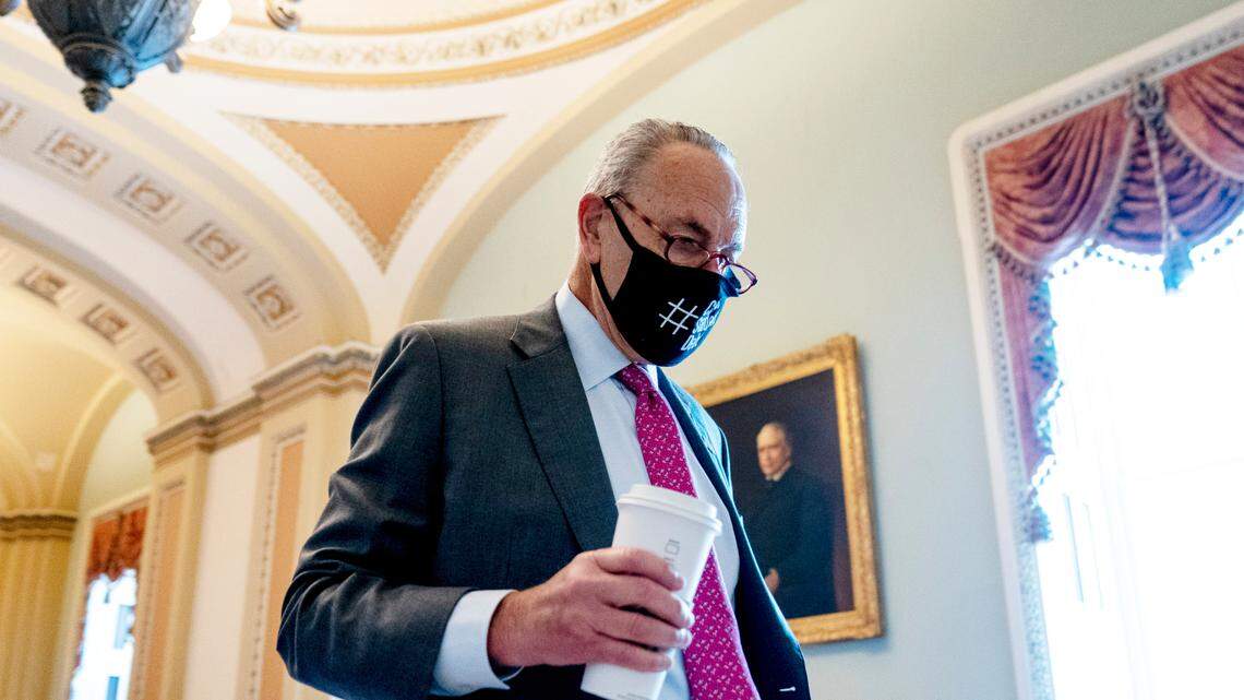 Senate Majority Leader Chuck Schumer arrives Tuesday before the $1 trillion bipartisan infrastructure package passed in the Senate. It includes funding for roads and bridges, clean water, broadband and more.