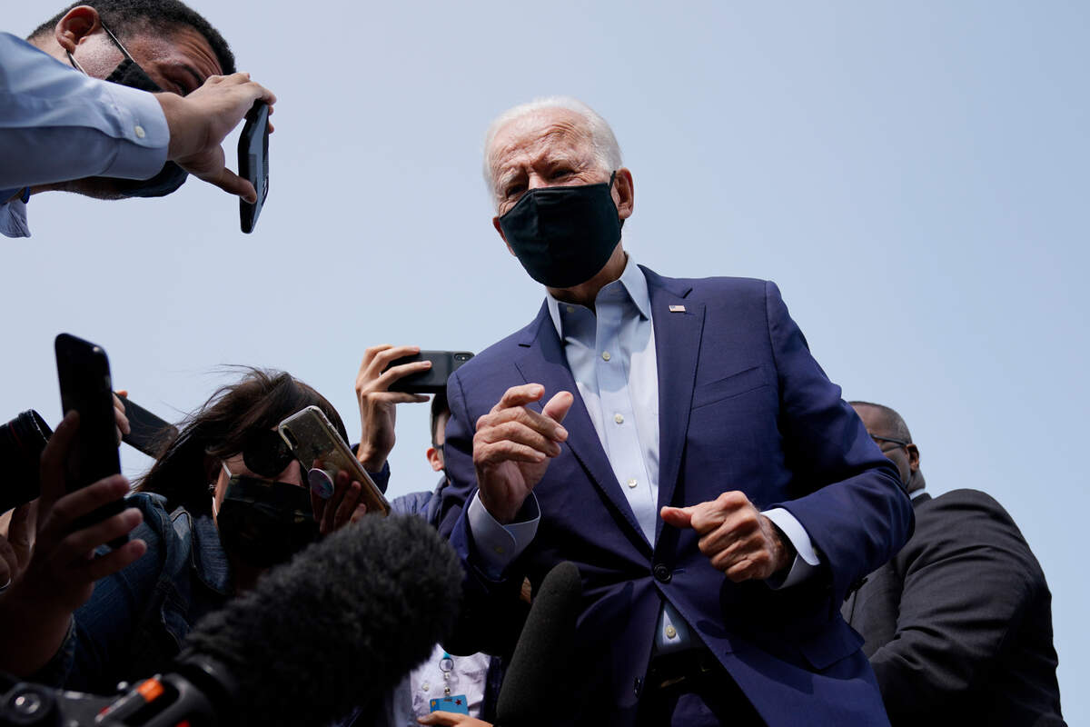 Democratic presidential candidate and former Vice President Joe Biden arrives and speaks to the media before boarding a plane at New Castle Airport in New Castle, Del., Tuesday, Sept. 15, 2020. Biden is traveling to Florida for campaign events. (AP Photo/Patrick Semansky)