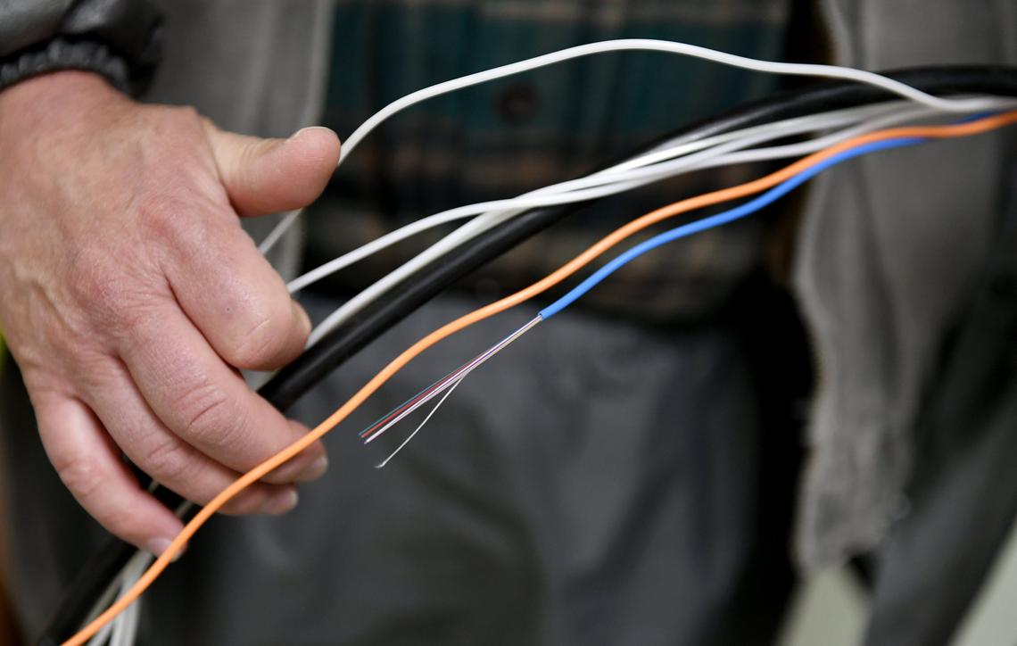 Jim Sheeley with Vantage Point shows some of the cables and fibers that could be run to help with broadband access on Feb. 13.