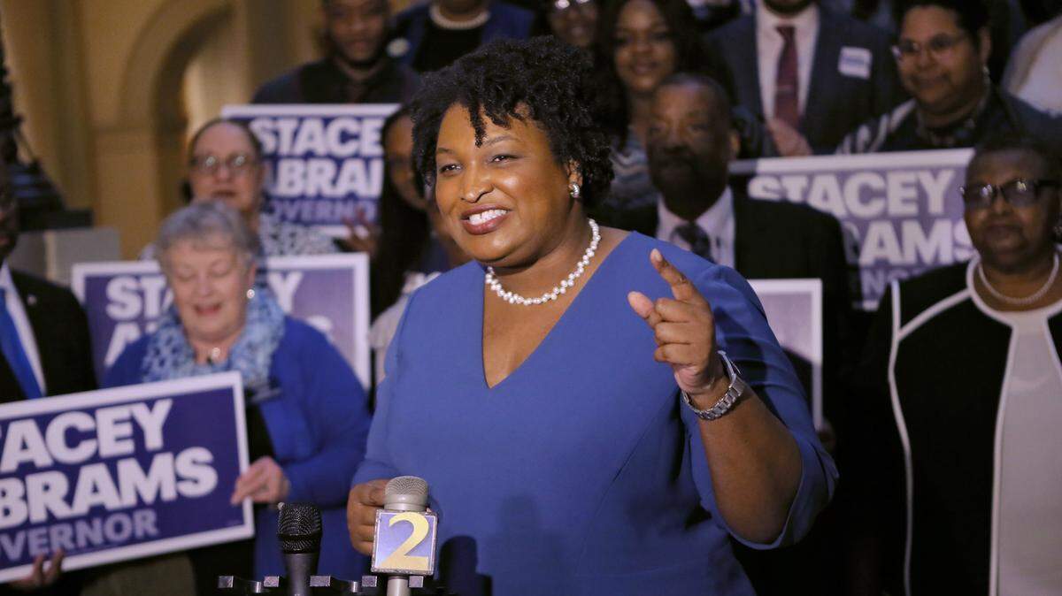 Stacey Abrams holds a news conference in Atlanta to announce she has qualified to run for governor in this Tuesday, March 6, 2018 photo. The record number of women expected to run for office in 2018 are already breaking barriers, upending traditional campaigning as they look to introduce themselves to an electorate they hope is eager for change. (Bob Andres/Atlanta Journal-Constitution via AP)