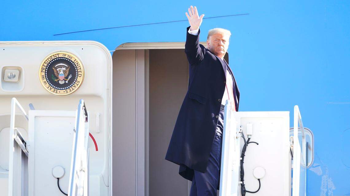 President Donald Trump waves before boarding Air Force One at Andrews Air Force Base, Md., for a trip to Alamo, Texas, Tuesday, Jan. 12, 2021. (AP Photo/Manuel Balce Ceneta)