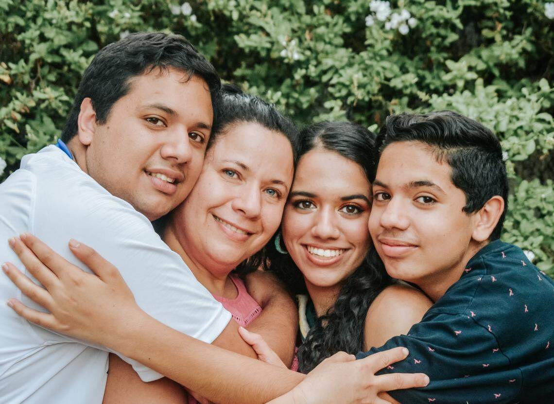 Osman Khan with his mother, Tania Valdes, and his sister and brother, Jasmin and Adam.