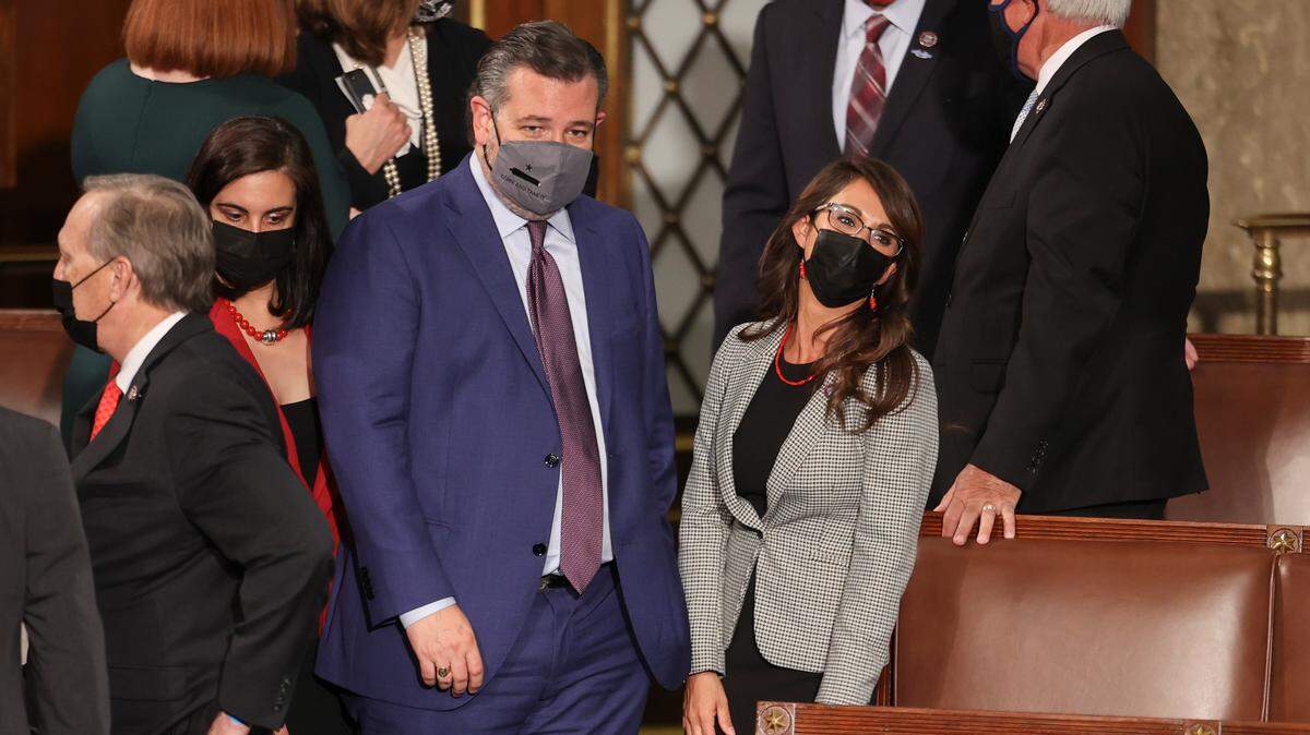 Sen. Ted Cruz, R-Texas, talks with Rep. Lauren Boebert, R-Colo., as they wait before President Joe Biden arrives to address a joint session of Congress, Wednesday, April 28, 2021, in the House Chamber at the U.S. Capitol in Washington. Cruz was seen dozing off during the address. (Jonathan Ernst/Pool via AP)