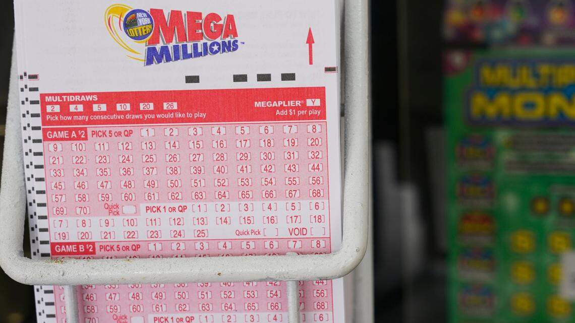 Mega Millions lottery slips are displayed, Wednesday, Jan. 11, 2023, in New York.