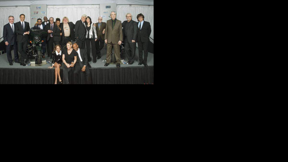 Cappy McGarr (far left) joins Jay Leno (center) after he received the Mark Twain Prize for American Humor at the John F. Kennedy Center for the Performing Arts in Washington, D.C. on Oct. 19, 2014.
