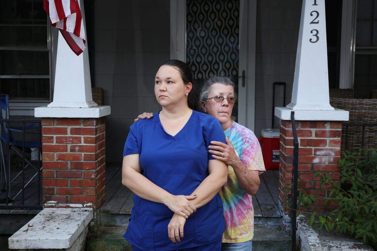 Joseph Williams’ sister, Emily Spell, outside of her home in Garland, North Carolina, with their mother, Susan.