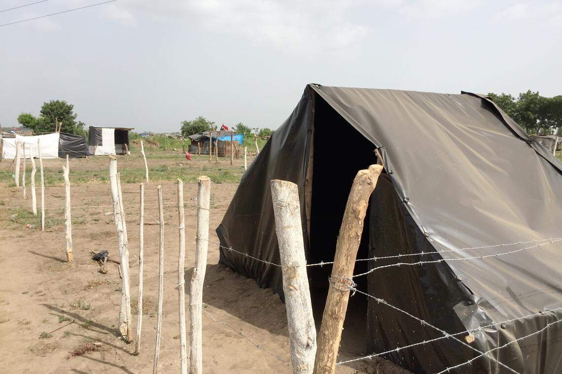 A simple hut made of black plastic sheeting is typical of the hundreds of structures now sitting on the property in Chinandega, Nicaragua, of César A. Castillo Cantón, a landowner whose property was taken over by squatters on June 1, 2018. The nation’s top business group says the government of embattled President Daniel Ortega has organized dozens of land takeovers to retaliate against affluent landowners who no longer support his government