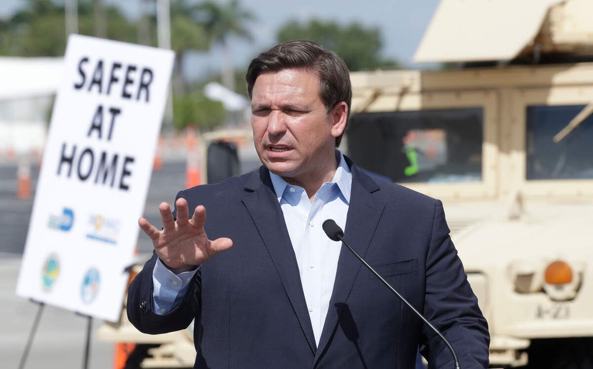 Florida Gov. Ron DeSantis speaks during a news conference at a drive-through coronavirus testing site in front of Hard Rock Stadium, Monday, March 30, 2020, in Miami Gardens, Fla. Gov. Ron DeSantis doesn’t want the people on the Holland America’s Zandaam where four people died and others are sick to be treated in Florida, saying the state doesn’t have the capacity to treat outsiders as the coronavirus outbreak spreads. (AP Photo/Wilfredo Lee)