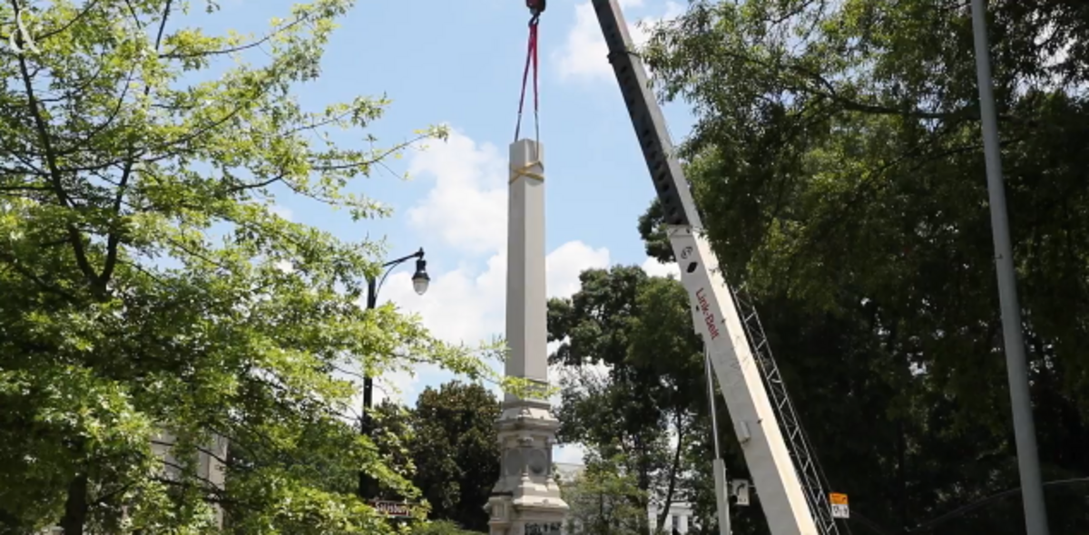 Workers struggled to remove the obelisk from a large Confederate monument on the North Carolina State Capitol grounds in Raleigh, N.C.