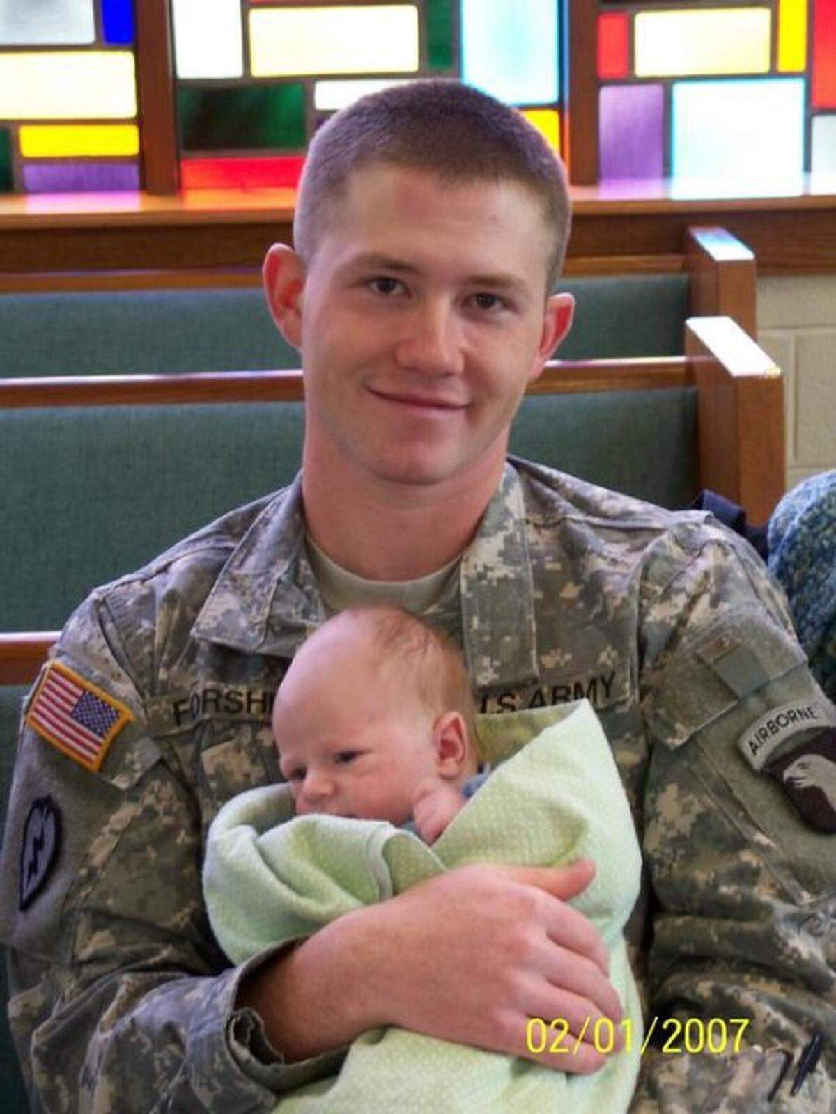Army Sgt. Curt Forshey, 22, holds his month-old son, Ben in February 2007 at the church where service members and spouses of the 494th Transportation Company at Fort Campbell, Ky., had gathered to say goodbye as the unit left for its second deployment to Iraq. Curt Forshey called his wife, Laura, that March with news that he was being medically evacuated due to the blood cancer Leukemia. He died days later.
