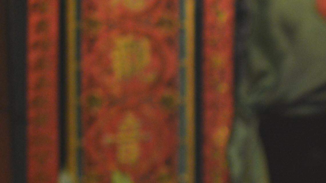 Wat, a 24 year old Hong Kong native, light incense sticks at Tin Hau Temple, on Temple Street in Kowloons' Yau Ma Tei District.  The temple is popular with worshippers even during times of protest, with the main Mongkok occupation area just a few blocks away.  Hong Kong, China.  Oct. 4, 2014.  (Chris Stowers/McClatchy)