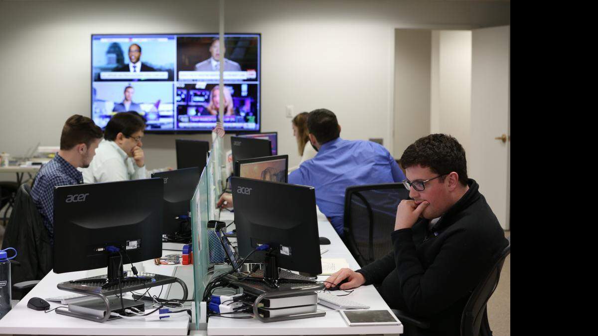 In the war room at the conservative political action committee America Rising in Arlington, Va., where walls are decorated with posters of Republican presidents such as Theodore Roosevelt and Ronald Reagan, staffers work in shifts between 6 a.m. and 11 p.m. on the seemingly mundane tasks of examining public records, statements and voting records hoping to dig up dirt on Democratic candidates.
