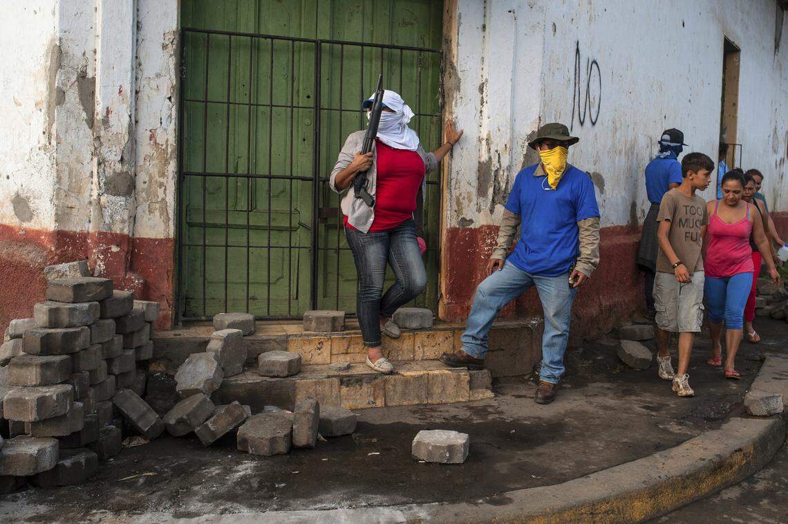 Sandinista militias stand guard at a dismantled barricade on Tuesday, July 17, 2018, after police and pro-government militias stormed the Monimbo neighborhood of Masaya, Nicaragua. Heavily armed police and militias laid siege to and then retook the symbolically important neighborhood that had recently become a center of resistance to President Daniel Ortega’s government.