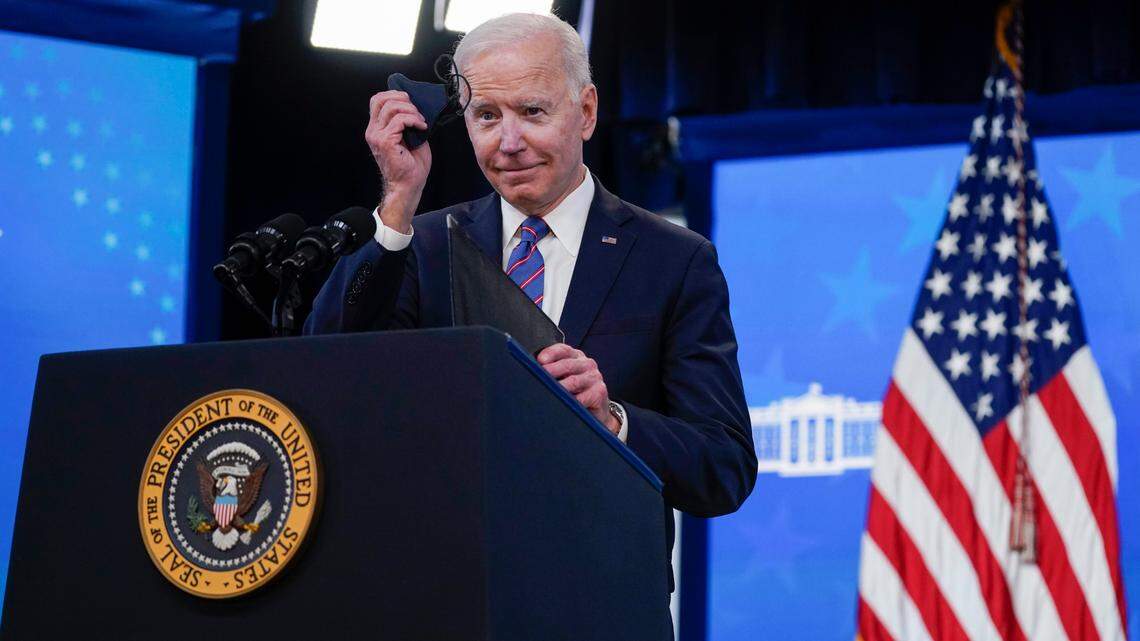 President Joe Biden holds a face mask as he speaks during an event to mark Equal Pay Day in the South Court Auditorium in the Eisenhower Executive Office Building on the White House Campus Wednesday, March 24, 2021, in Washington. Two agencies in his administration are hosting a “mask innovation” contest. (AP Photo/Evan Vucci)