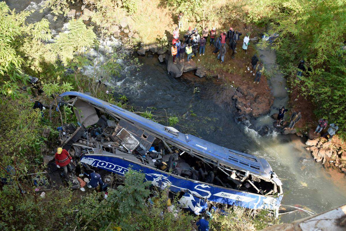 A view of the wreckage of a bus that plunged into Nithi bridge on Sunday, in Tharaka Nithi county Meru, Kenya, Monday, July 25, 2022. (AP Photo/Dennis Dibondo)
