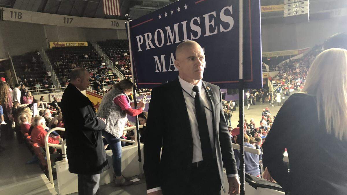 Jordan Goudreau working security at what appears to be a political event for then-President Donald Trump.