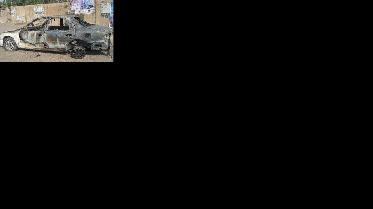 A car at a traffic circle in central Baghdad where a shoot-out on Sept. 16, with private security company Blackwater, left 9 Iraqis dead and 15 injured.