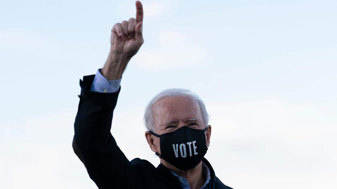 President-elect Joe Biden acknowledges the crowd as he campaigns for for Georgia Democratic candidates for U.S. Senate, Rev. Raphael Warnock and Jon Ossoff in Atlanta, Monday, Jan. 4, 2021. He said during the rally that Americans would get $2,000 stimulus checks if Ossoff and Warnock win. (AP Photo/Carolyn Kaster)