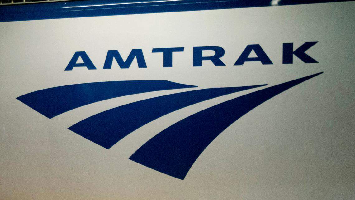 FILE - In this Feb. 6, 2014 file photo, an Amtrak logo is seen on a train at 30th Street Station in Philadelphia. Amtrak is modifying service in the Northeast and Midwest because of winter storms moving through the region. The Capitol Limited, from Chicago to Washington, and the Lake Shoe Limited, from Chicago to New York, are canceled on Saturday, Jan. 19, 2019. (AP Photo/Matt Rourke, File)
