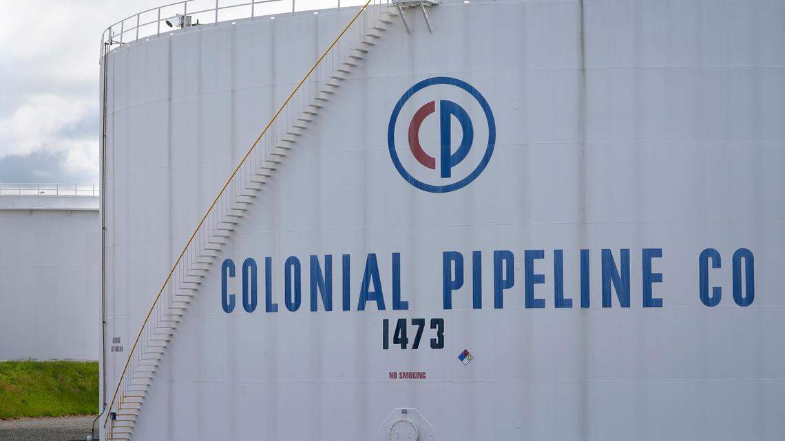 Colonial Pipeline storage tanks are seen in Woodbridge, N.J., Monday, May 10, 2021. The FBI says DarkSide is behind the cybersecurity attack that caused the company to pause operations. (AP Photo/Seth Wenig)