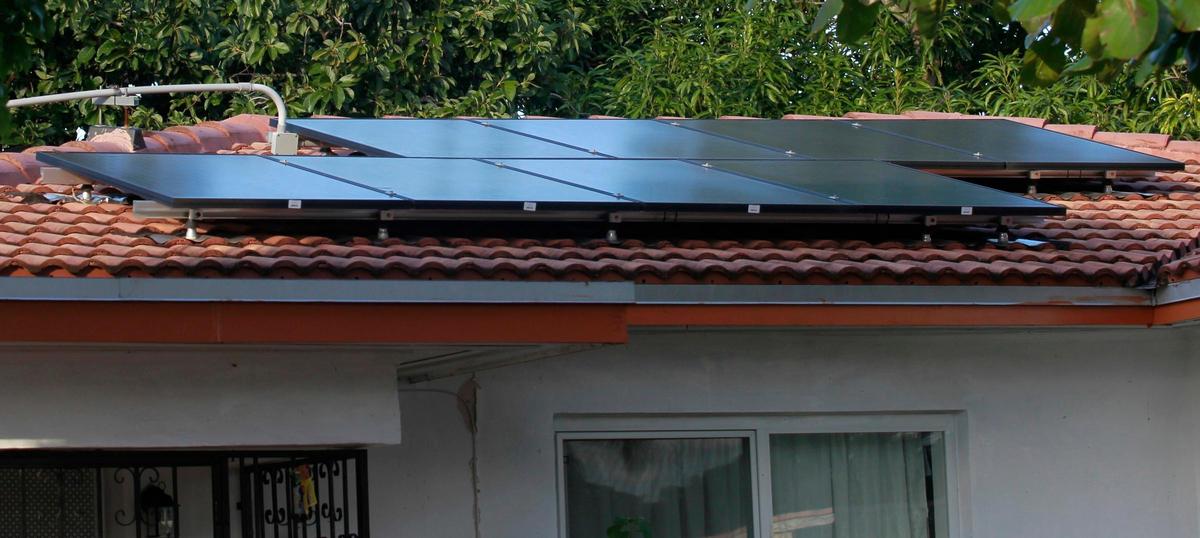 Julnor Jean paid a contractor to install these solar panels on his roof, financing the project over 20 years under a program called PACE. He says he was told the panels would eventually reduce his electric bill to zero. They don’t work.