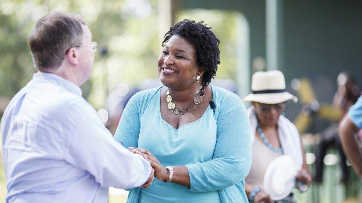 Georgia House Minority Leader Stacey Abrams greets a guest after announcing her entry into the state's 2018 gubernatorial race in Albany, Ga., on June 3.  Melissa Golden for The Washington Post.