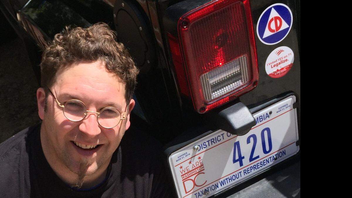 A 420 license plate, a gift from Washington D.C. Mayor Muriel Bowser, adorns the 2015 Jeep Wrangler owned by Adam Eidinger, who led the drive to legalize marijuana in the city. The number is code for smoking marijuana. Photo taken April 17, 2015.
