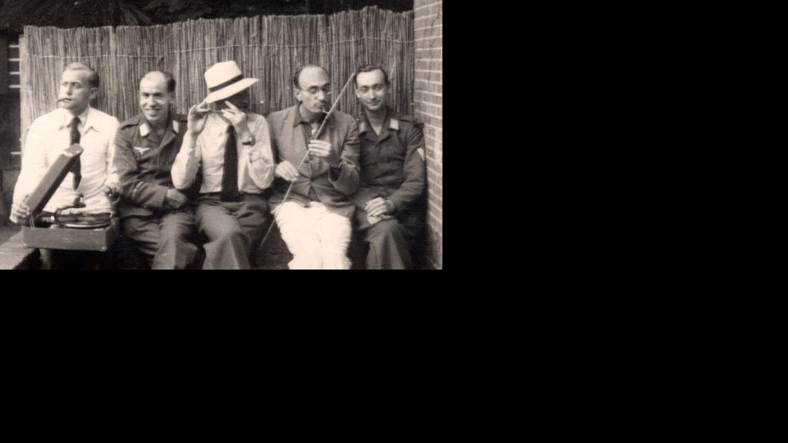 During a rare bit of down time during World War II, the two uniformed German soldiers who helped run a rescue and hideaway effort for Jews in Holland relax with their co-conspirators. Mels de Jong, Gerhard, Sam van Perlstein, Johnny Lefbvre and Werner Klemke (left to right). The photo was taken between 1942 and 1944 and is used with the permission of the van Perlstein family. (McClatchy)

