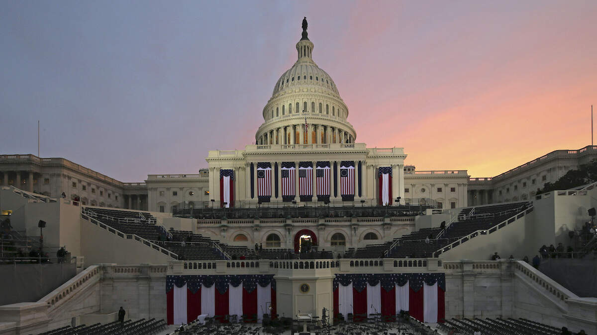 The sunrises early in the morning before the ceremonial swearing-in of President Barack Obama at the U.S. Capitol in Washington, Monday, Jan. 21, 2013, for the 57th Presidential Inauguration. (AP Photo/Scott Andrews, Pool)