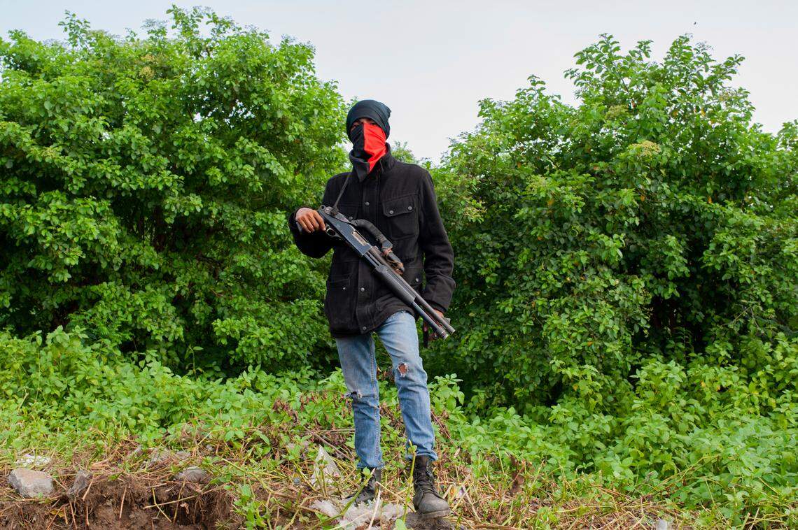 An armed Sandinista paramilitary before the arrival of President Daniel Ortega, in Masaya, Nicaragua, Friday, July 13, 2018.