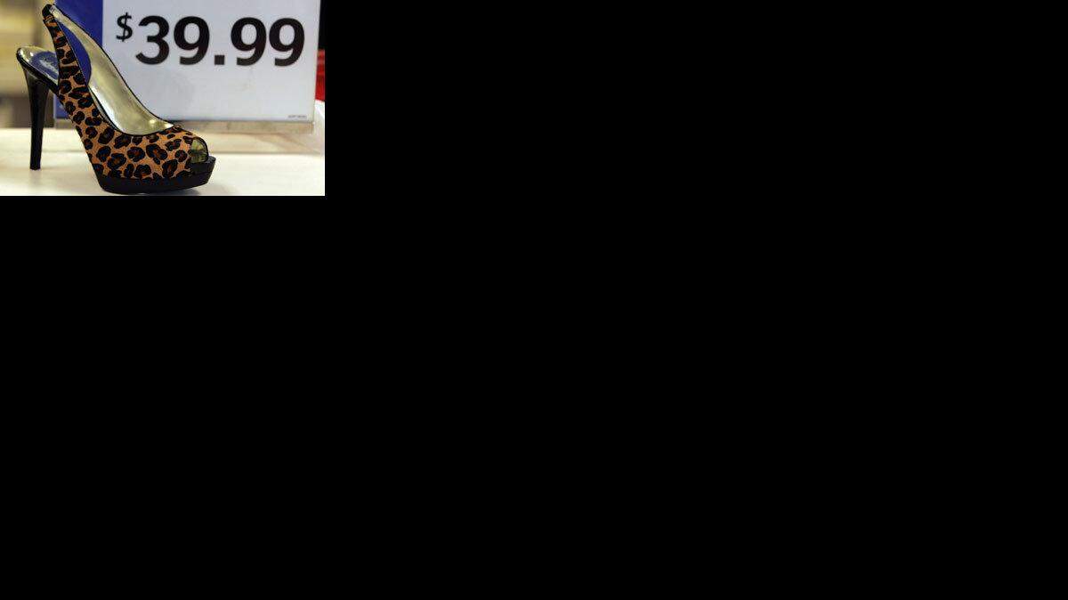 Hundreds of sale prices on designer shoes can be found at this store in San Jose, California, April 8, 2009. Many shoppers are downgrading where they shop due to the tough economic times. (Karen T. Borchers/San Jose Mercury News/MCT)