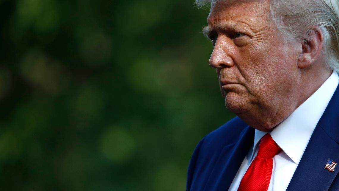 FILE - In this July 15, 2020, file photo President Donald Trump walks on the South Lawn of the White House in Washington after stepping off Marine One. Trump’s pledge to rollback an Obama-era effort to eliminate racial disparities in America’s suburbs is drawing harsh criticism from fair housing advocates, who call it a blatant attempt at racial politics and an appeal to white votes before the November election. (AP Photo/Patrick Semansky, File)