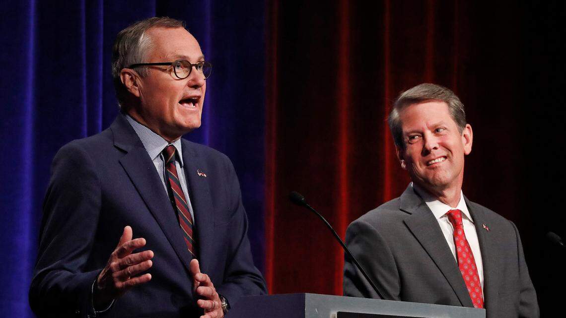 Georgia Lt. Gov. Casey Cagle, left, and Secretary of State Brian Kemp speak during an Atlanta Press Club debate, July 12, 2018.