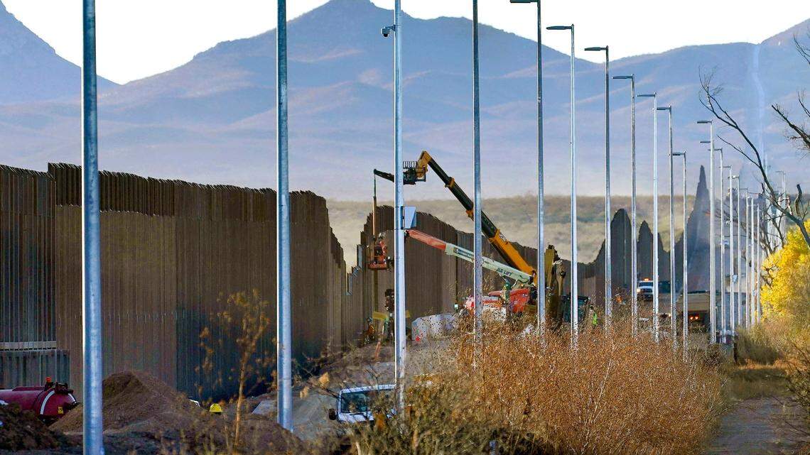 FILE - Crews construct a section of border wall in San Bernardino National Wildlife Refuge, Tuesday, Dec. 8, 2020, in Douglas, Ariz. President Joe Biden last week ordered construction on the wall to pause. (AP Photo/Matt York)