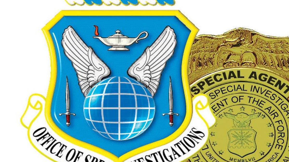 The badge and shield of the Air Force Office of Special Investigation, whose agents recruit informants at military bases.