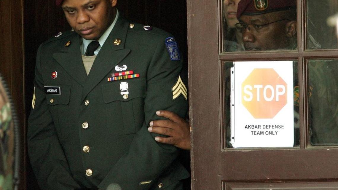 
Sgt. Hasan Akbar, left, is led from the Staff Judge Advocate Building at Fort Bragg, N.C., Wednesday, April 27, 2005, during the sentencing phase of his court-martial. 
