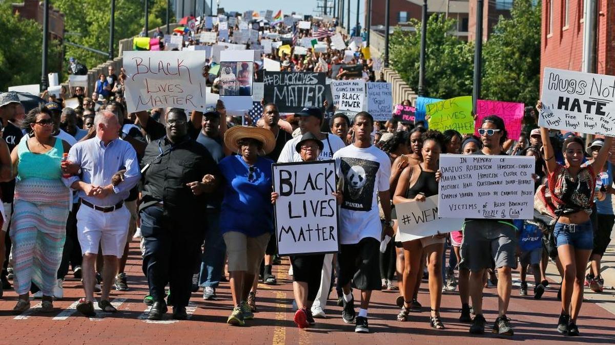 People march in a Black Lives Matter rally in Oklahoma City on Sunday. Multiple protests across the country have broken out in wake of the deaths of Alton Sterling, Philando Castile and five Dallas police officers.