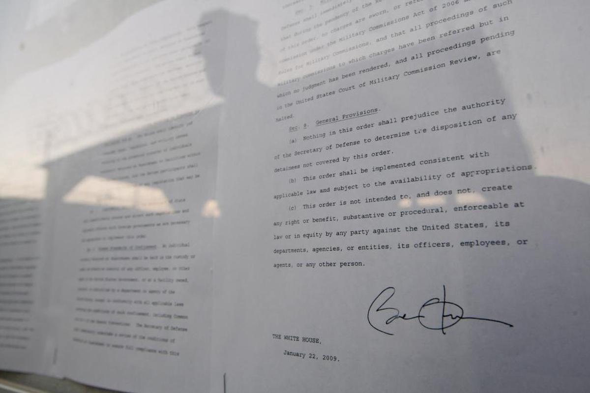 On April 2, 2009, prison camp guards had posted a copy of President Barack Obama’s Jan. 22 Executive Order on a bulletin board at Camp 4 in this image approved for release by the military, at the U.S. Navy Base at Guantánamo Bay, Cuba. This photo shows Obama’s signature on the order requiring the closure of the prison camps by Jan. 22, 2010.